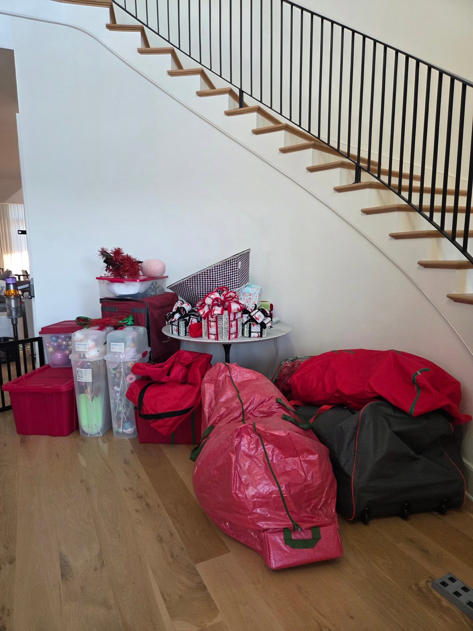 Seasonal decorations packed into labelled storage under a staircase
